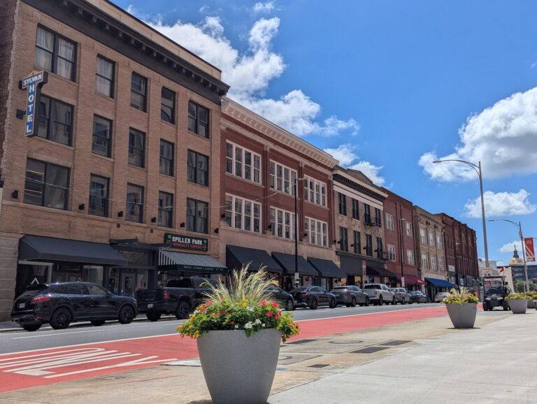 Restored storefronts on Hotel Row in South Downtown Atlanta with the Georgia Capitol dome in the distance