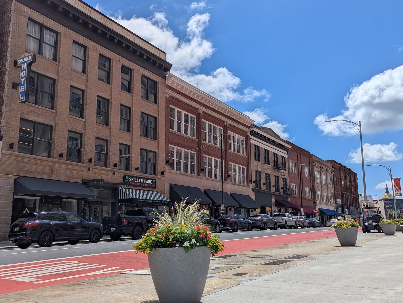 Restored storefronts on Hotel Row in South Downtown Atlanta with the Georgia Capitol dome in the distance